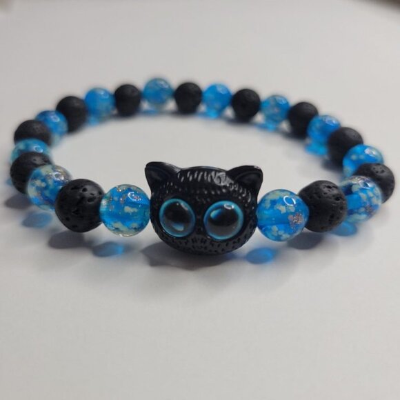 NWT Glow In The Dark Ladies Black & Blue Chinese Cat Lava Rock Stretch Bracelet - Picture 1 of 7